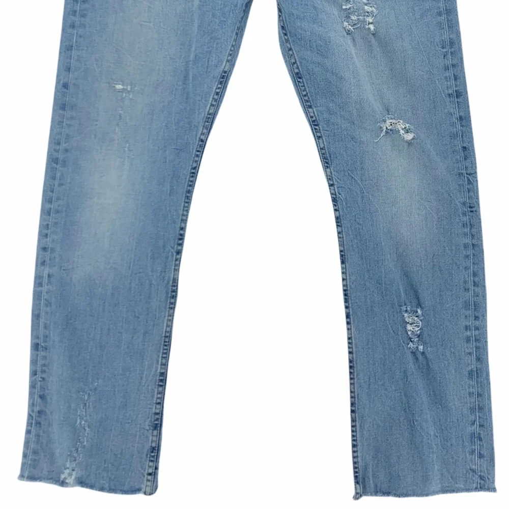 Levi’s 513 Slim Straight Distressed Light Wash Jeans